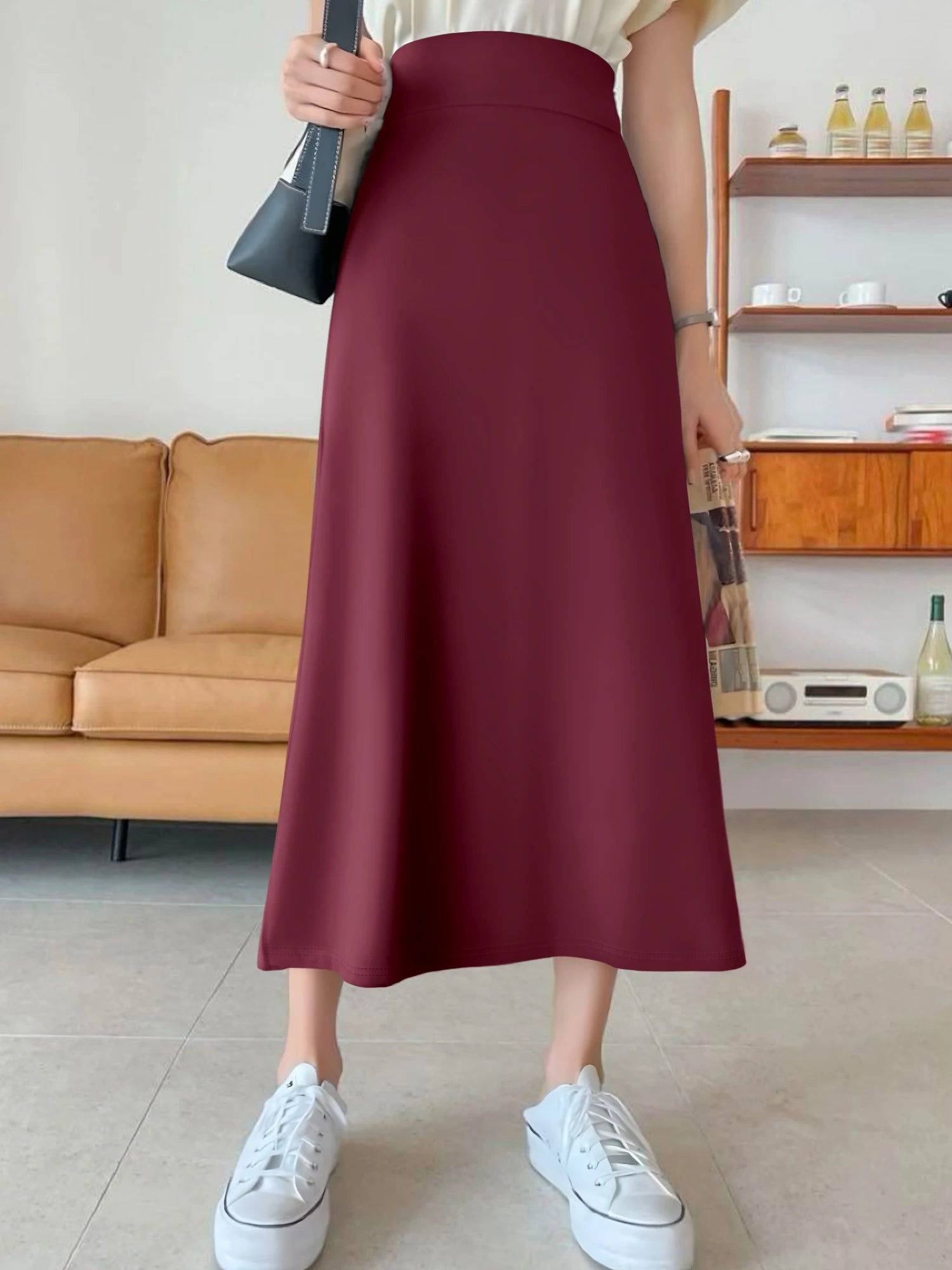 Korean-style solid color mermaid skirt, high-waisted A-line fit to hide the hips, slightly flared hem to show curves, suitable f
